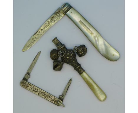 Two silver fruit knives and a silver rattle hallmarked Birmingham 1900