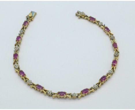 A 14ct gold, ruby and diamond bracelet, 7.9g