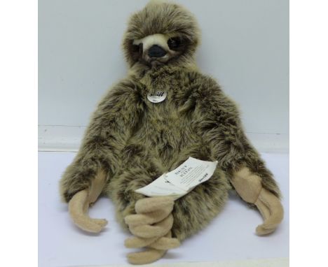 A Steiff sloth with magnetic hands