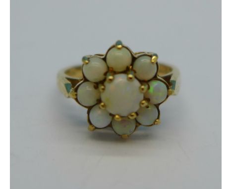 A 9ct gold, nine stone opal ring, 2.8g, L