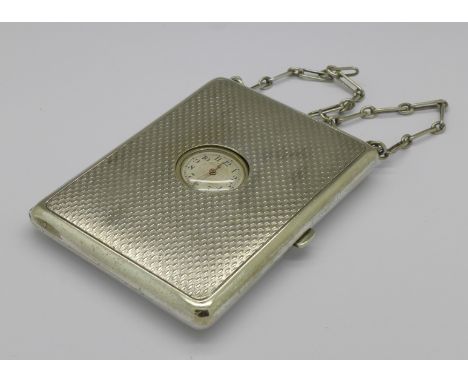 A white metal combination double sovereign case, clock, purse and compact