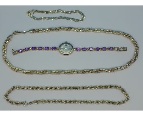 Silver jewellery; two necklaces, a bracelet and a stone set wristwatch