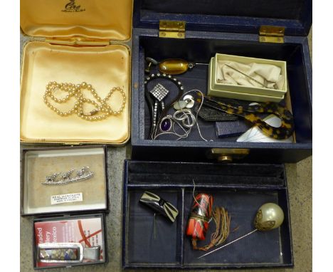 Vintage costume jewellery including a string of faux pearls with 9ct gold clasp, cotton reel holder, silver jewellery, stick 