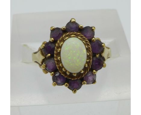 A 9ct gold, opal and purple stone cluster ring, 3.1g, M