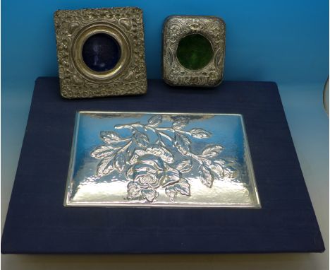 A silver front pocket watch stand, a silver photograph frame, a/f, and a silver mounted photograph album