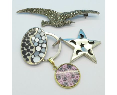 Three silver pendants and a marcasite set bird brooch