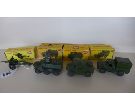 Four boxed Dinky Military vehicles 25 pounder field gun, armored personnel carrier, Field Artillery tractor and Army 1 ton ca