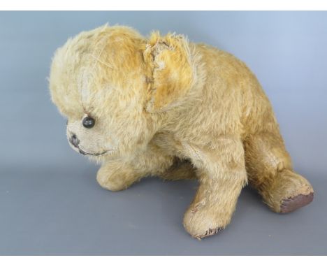 A vintage mohair dog with boot button eyes - Height 26cm x Length 32cm - with wear and repairs