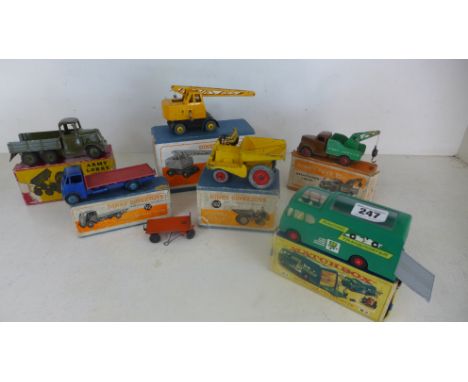 Four boxed Dinky Toys Coles, mobile crane, Guy Flat truck S12, dumper truck S62, breakdown lorry and a Britain's Army lorry a