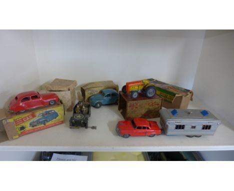 Five tinplate toy vehicles including a Chad Valley remote control car, a Willis Jeep, a Nuffield Exports Morris Minor, a TRac