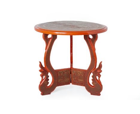 A BURMESE RED LACQUER TRIPOD TABLE
Of small proportions, the supports in the form of dragons, with stylised decoration to the