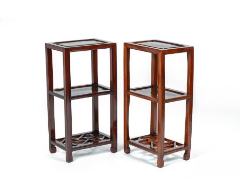 A PAIR OF CHINESE ELM SIDE TABLES
With a panelled top and shelf beneath, the base with a conjoining geometric carved and pier