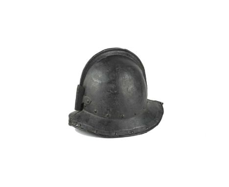 A 17th century English pikeman's helmet, two-piece construction with low comb and turned-down brim, the base of the skull and