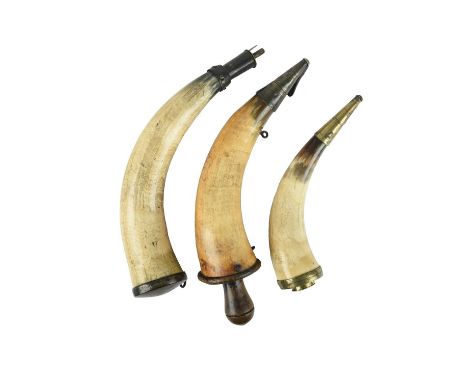 A priming horn, cow horn body, brass spout with spring loaded shutter, wooden base with threaded wooden plug, two iron suspen