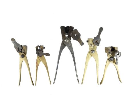 A collection of five bullet moulds for casting hollow-based bullets, each with an integral base plug and steel sprue cutter, 