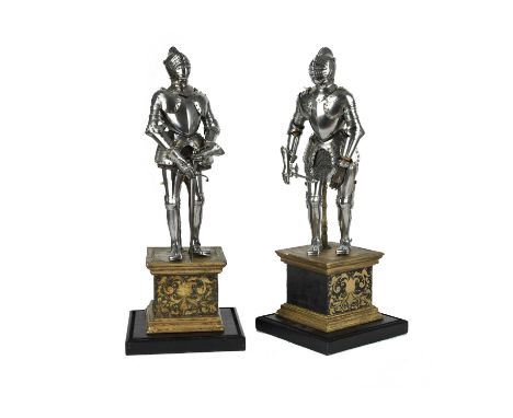 A pair of fine miniature armours, 19th century in the 16th century style, each comprising: a close helm with high comb finish