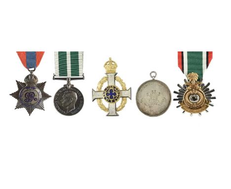 A small collection of medals and insignia, comprising: an Imperial Service Medal, star type, George V, reverse engraved (WILL