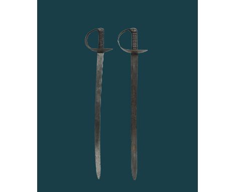 Two British pattern 1845 naval cutlasses, the first of standard form, slightly curved blade 29 in., sheet iron guard with bra