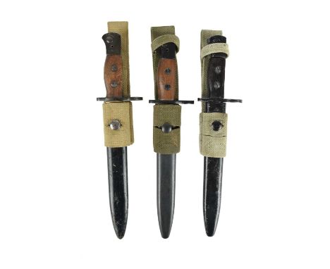 Three British No 5 Mk I bayonets, 2nd type, in steel scabbards with webbing frogs. [3]34.4cm OAL longest item including canva