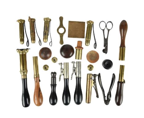 A collection of vintage cartridge loading tools, including: a roll turnover tool for 12 bore pinfire cartridges by G.&amp;J.W