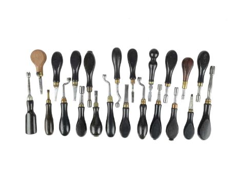 A quantity of vintage gun maintenance tools, most with characteristic ebonised wood handles, comprising: thirteen nipple keys