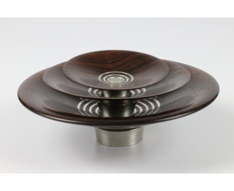 John Wessels (South Africa) striped ebony and pewter nest of three bowls 5x15, 3x13 and 2x8cm. Signed
&nbsp;
I first met Ray 