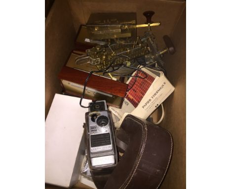 A box of misc scientific instruments to include telegraph keys, alarm barometers and a Bell and Howell cine camera. 