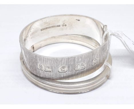 A hallmarked silver bangle and a foreign silver bangle, diameters approx. 60mm and 55mm, weight 60.30g. 