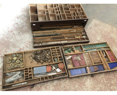 A wooden box of vintage Meccano parts 