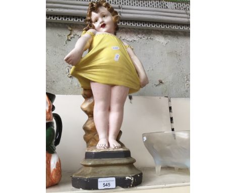 A 1930's Art Deco gesso figure of a girl.Condition: various small chips to base and other corners, other age related wear thr