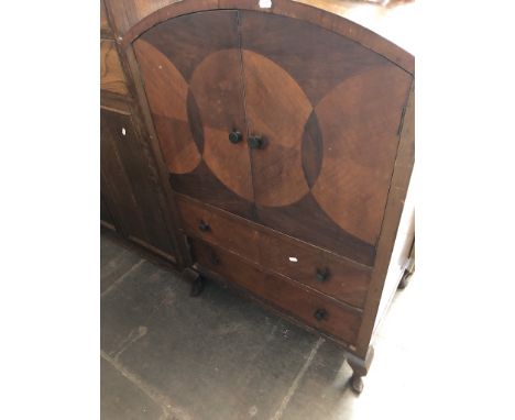 An Art Deco domed top cupboardDimensions: H113cm, W76cm, D51cm.