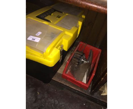 A Stanley toolbox with tools and a small box with jigsaw blades and cutting disks. 