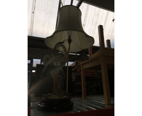 A resin figural lamp with shade - stalks 