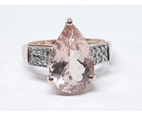 A hallmarked 9ct gold ring set with a pear cut pale peach/pink morganite, gross wt. 2.94g, size N. 