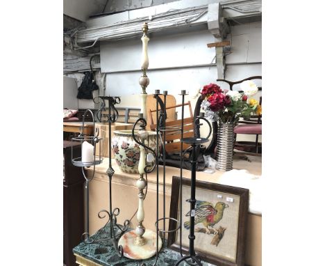An Onyx standard lamp and 4 tall metal candle stands 