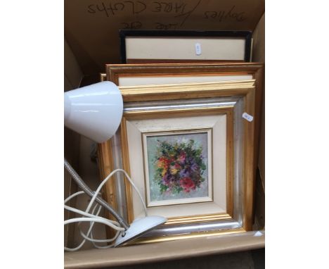 A box of pictures and an anglepoise lamp. 