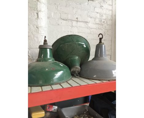 A set of three enamel light shades.