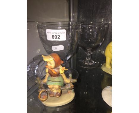 A pair of 19th century ale glasses and a Hummel figure 