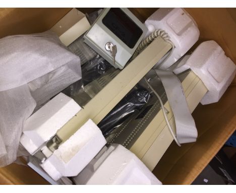 A vintage Amstrad PC with peripherals and related items.