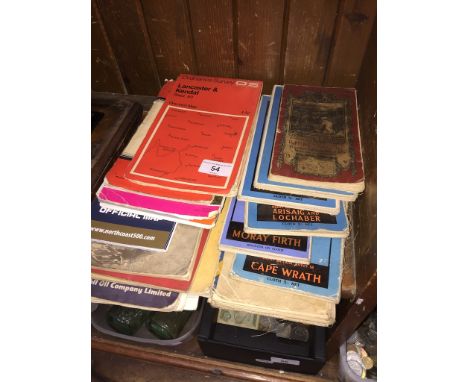 A collection of vintage canvas OS maps and touring guide books. 