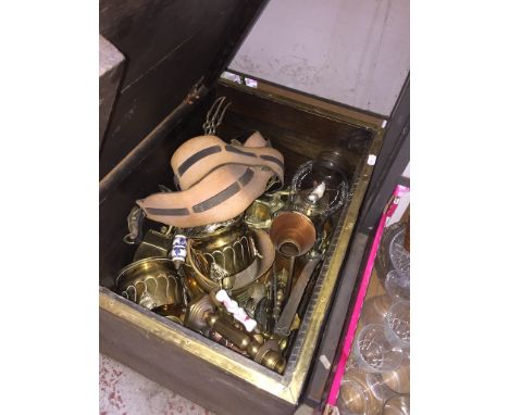 A brass bound coal box containing mainly brassware, but also including some copper items and an oil lamp 
