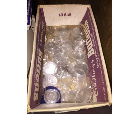 A box of coin capsules 