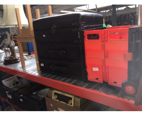 A leatherette trunk, nest of 2 tables, pictures and a plastic trolley/truck 