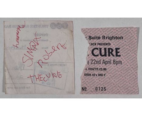 A TSB bank slip (dated Sep 1980) signed to reverse by Robert Smith, Simon Gallup, Lol Tolhurst (8x8cm). Also a portion of a t