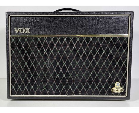 A Vox cambridge 30 reverb V9310 guitar amplifier, serial no: 0003346. With footswitch, small tear to fabric and a thin line o