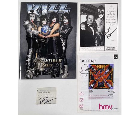 A Kerrang page (c 2000s) with Kiss advert signed by Gene Simmons, Paul Stanley, Tommy Thayer, Eric Singer. Also a ticket and 