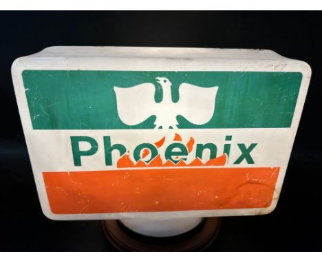A Phoenix plastic petrol globe, corner missing.