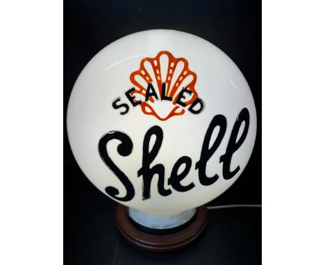 A Sealed Shell pill-shaped glass petrol pump globe stamped Chance Brothers to outer neck and Property of Shell-Mex Limited Re