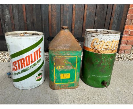 Two Castrol five gallon drums and a BP Energol Tractor five gallon pyramid can. 