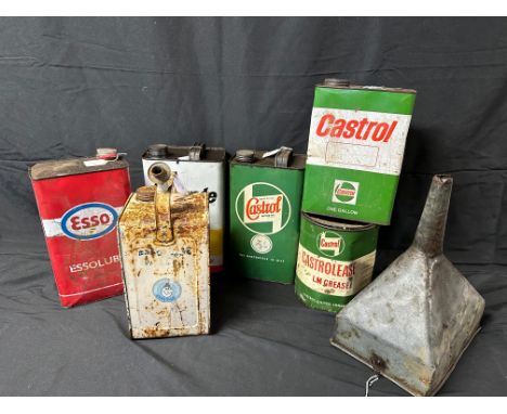 A selection of oil cans and a funnel inc. Esso, Castrol, Esso Blue etc.